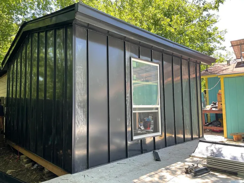 Black standing seam metal wall panels for Roof Inspection in Robertsdale